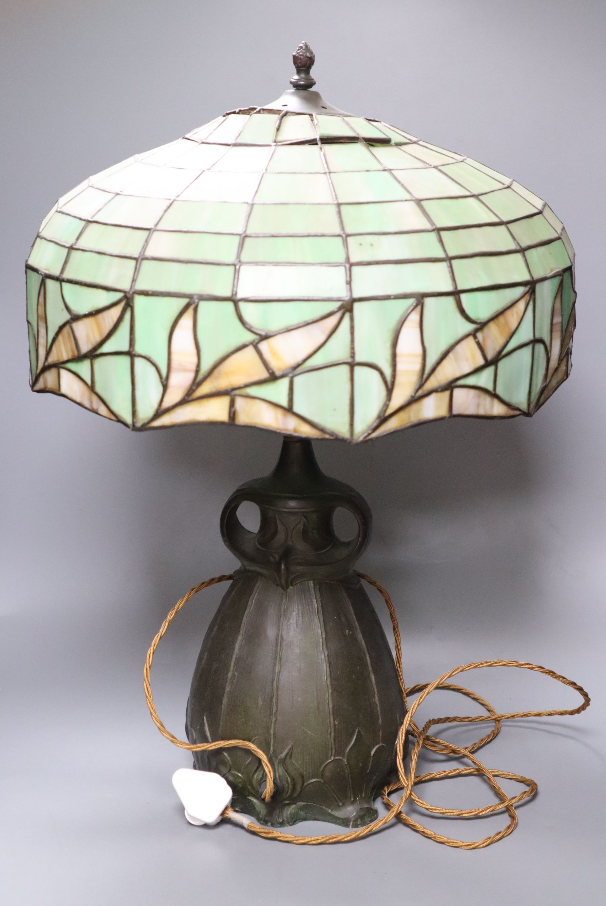 A spelter lamp with Tiffany style shade